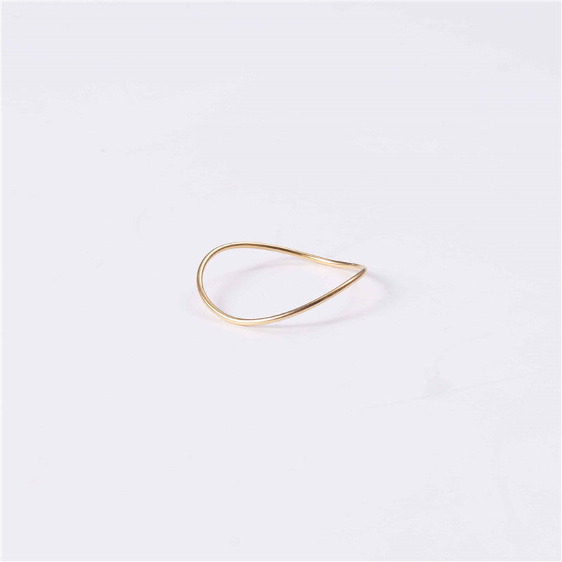 Fine gold ring. 18k gold. Perfect for layering and to accompany other rings. Wave shape and easy fit.